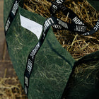 Detaljebillede af grøn høpose med robuste stropper og slidstærkt design